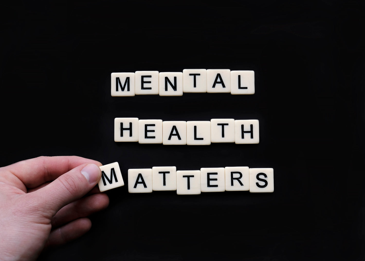 tiles-lay-on-a-black-surface-reading-mental-health-matters